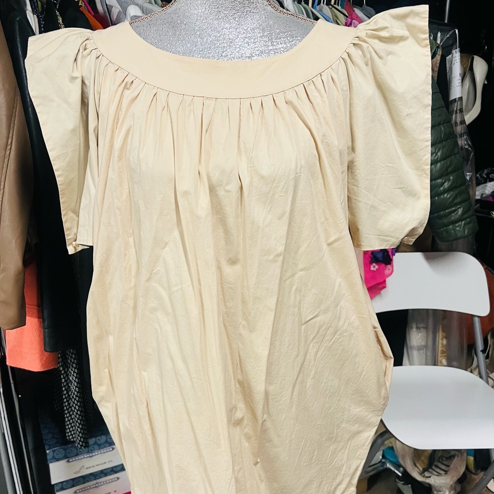 One of a kind dress with back out.